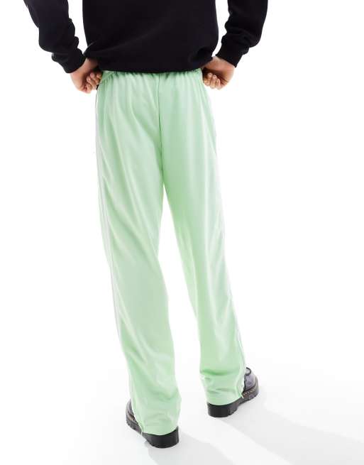 adidas Originals Firebird unisex track pants in pastel green ASOS