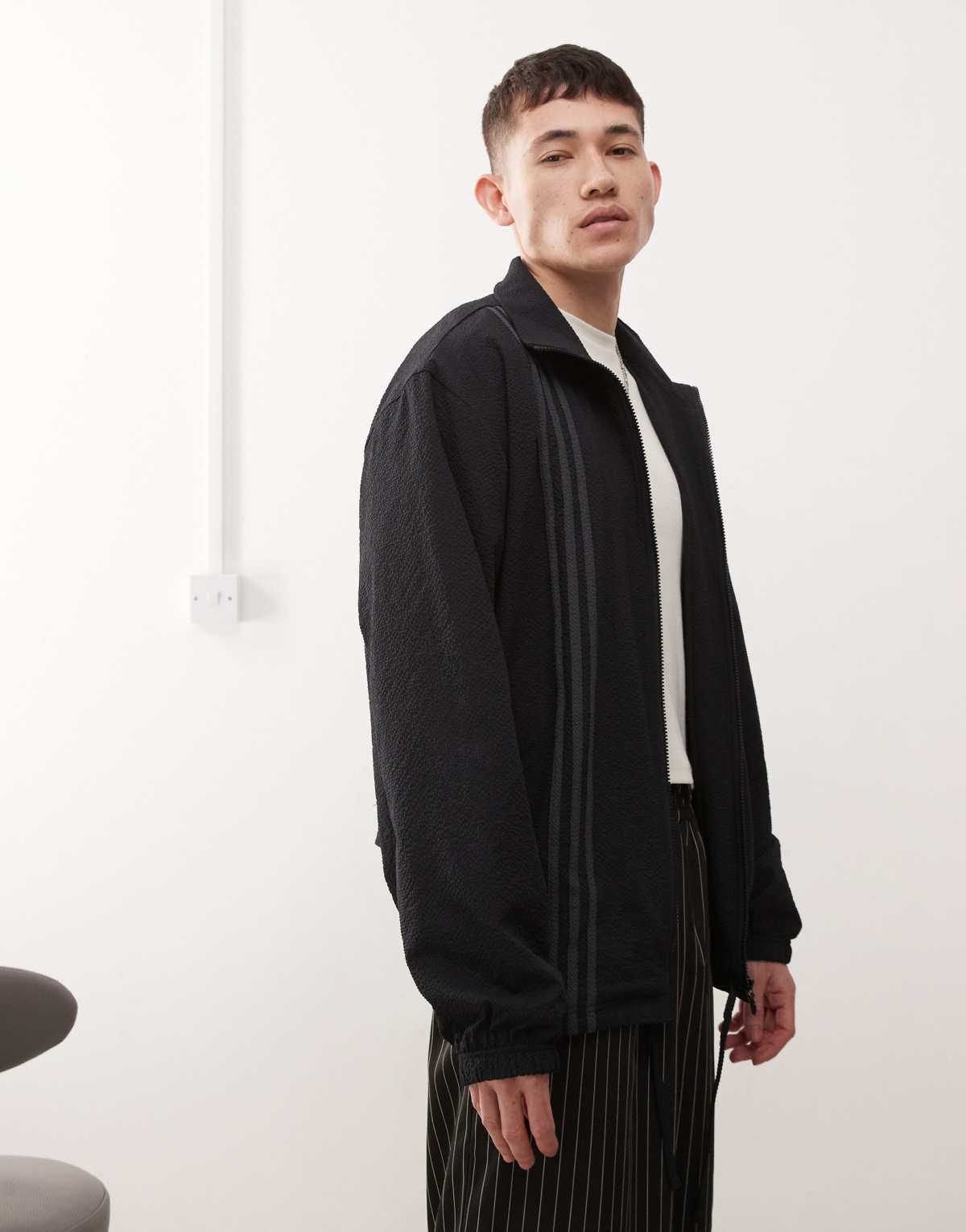 adidas Originals Firebird vertical 3-stripe track top in black