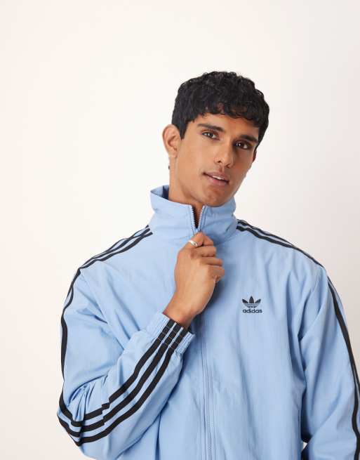 adidas Originals Firebird woven track top in blue ASOS