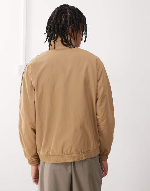 adidas Originals Firebird woven track top in brown and black