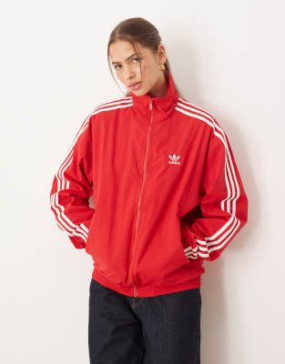 adidas Originals Firebird woven track top in red