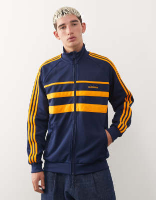 adidas Originals - First - Veste de survêtement - Bleu marine et orange