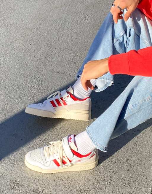 Adidas red best sale and white sneakers