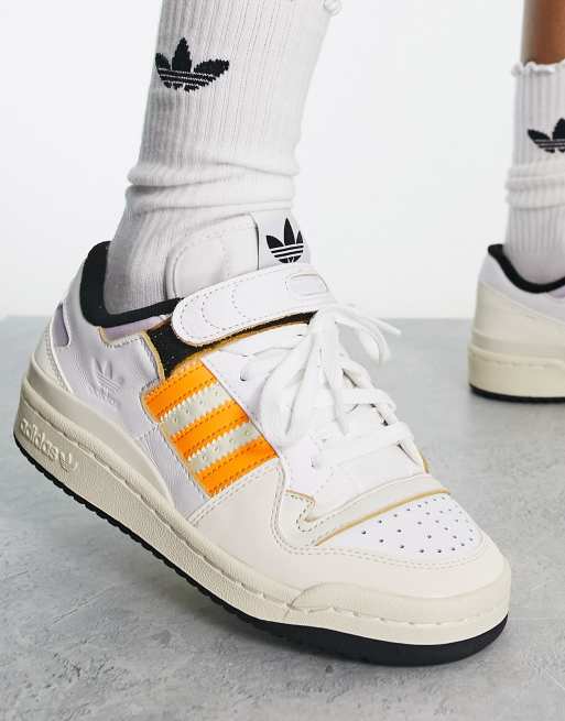 Adidas with store orange stripes