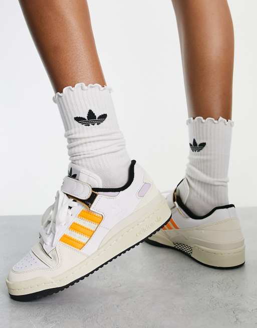 Adidas with orange store stripes