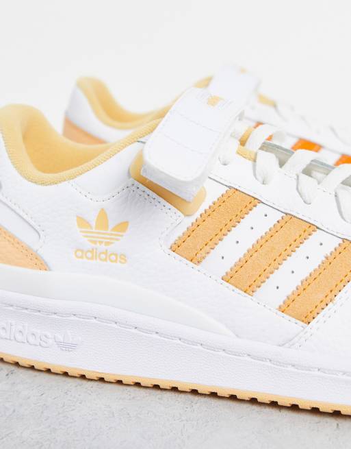 adidas Originals Forum low sneakers in white with alternating orange stripes