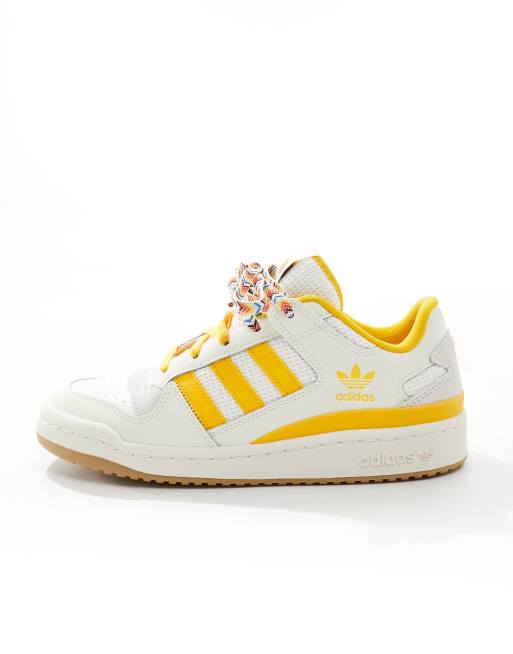 Adidas white 2025 and yellow sneakers