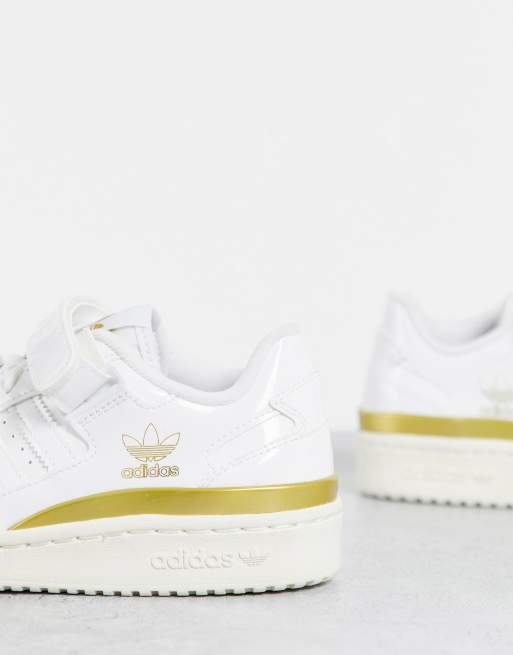 Ladies white and hot sale gold adidas trainers