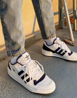 white and navy adidas trainers