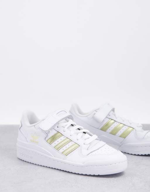 Adidas with store gold stripes