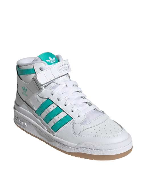 White adidas outlet with green stripes