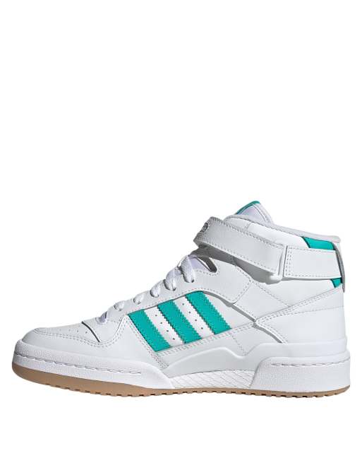 adidas Originals Forum mid sneakers in white with green stripes |