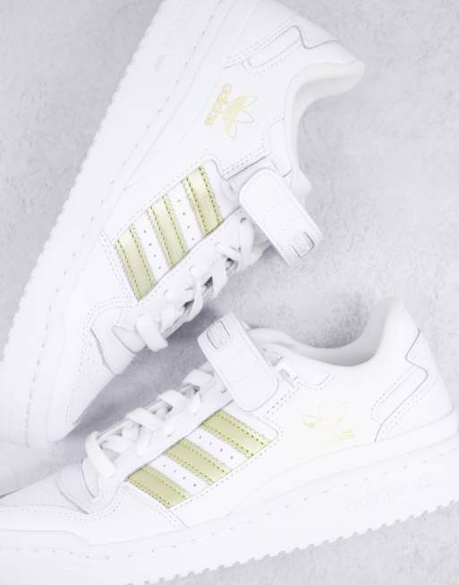 Adidas store strisce oro