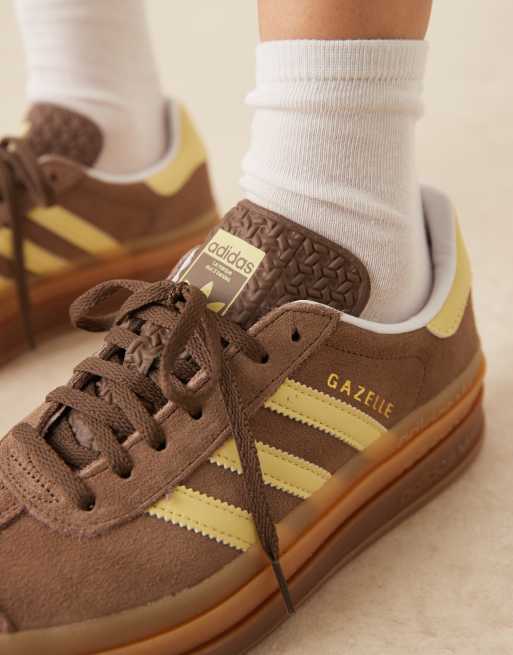 adidas Originals Gazelle Bold platform trainers in brown and yellow
