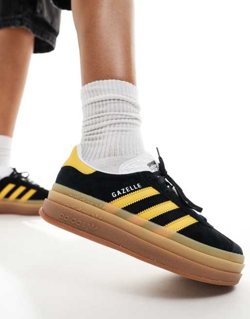  adidas Originals Gazelle Bold platform trainers in black and gold