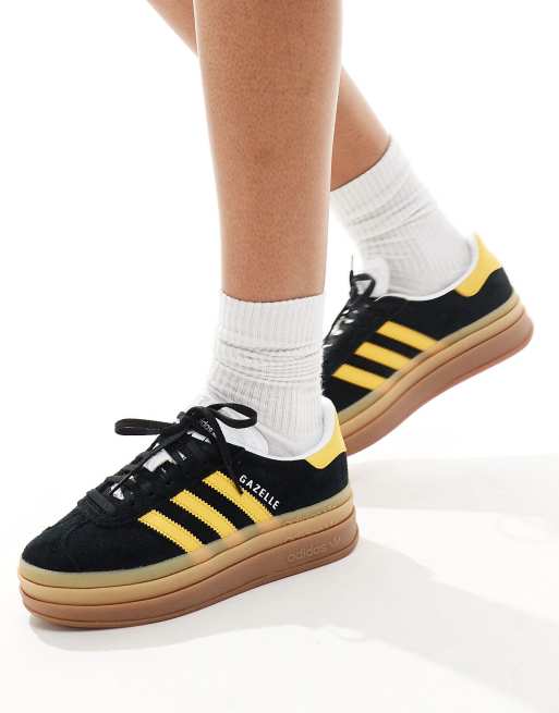 adidas Originals Gazelle Bold platform trainers in black and gold