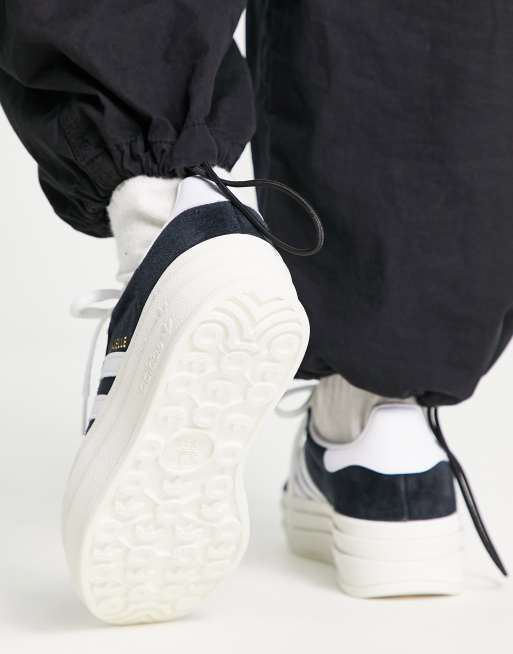 womens black and white gazelles