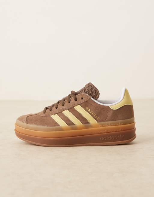 adidas Originals Gazelle Bold platform trainers in brown and yellow