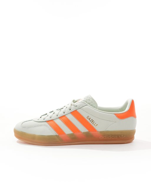 adidas Originals Gazelle Indoor trainers in light green and orange with gum sole