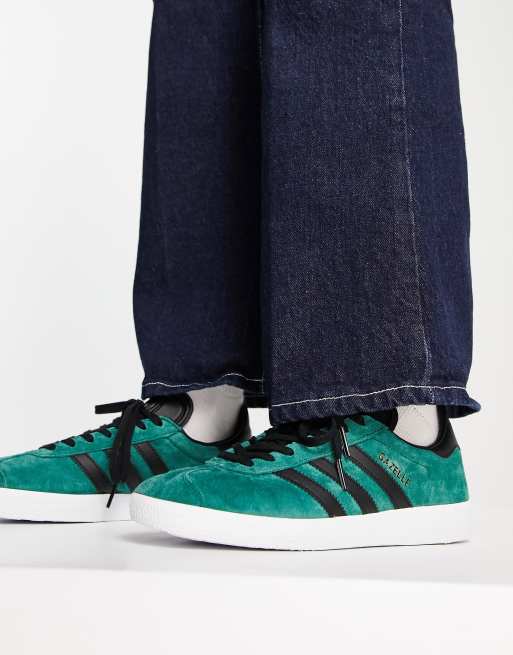 Black adidas with green stripes sale