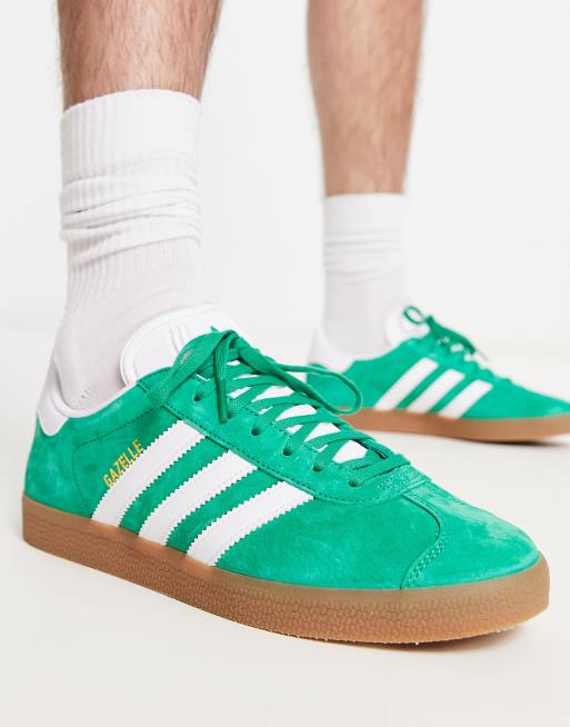 adidas Originals Gazelle trainers in green with gum sole