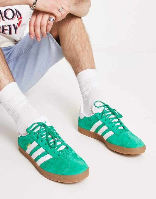 adidas Originals Gazelle trainers in green with gum sole