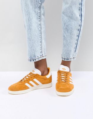 mustard coloured adidas trainers