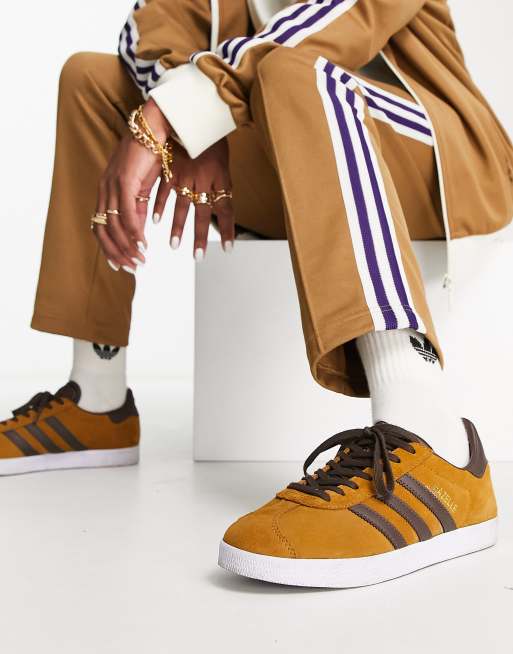 Mustard coloured adidas store trainers