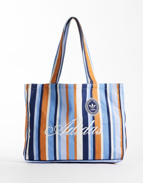 adidas Originals – Gestreifte Tragetasche in Blau und Braun mit Logo-Schriftzug - view 1
