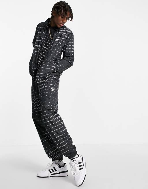adidas Originals - Giacca sportiva nera con logo ripetuto
