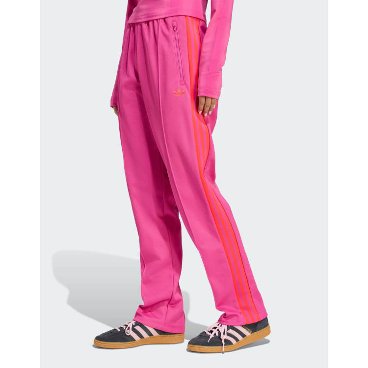 adidas Originals Graphic track pants in semi lucid fuchsia