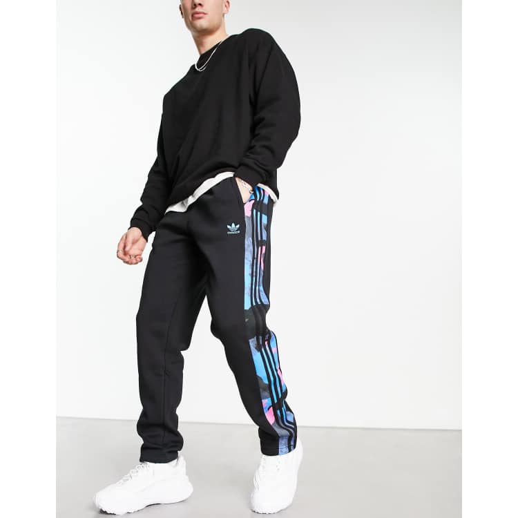 adidas Originals Graphics camo three stripe sweatpants in black