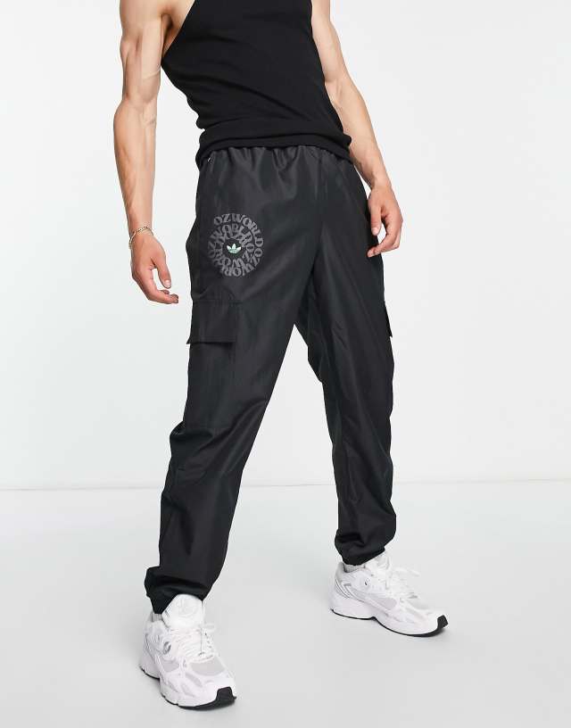 adidas Originals Graphics Ozworld cargo sweatpants in black