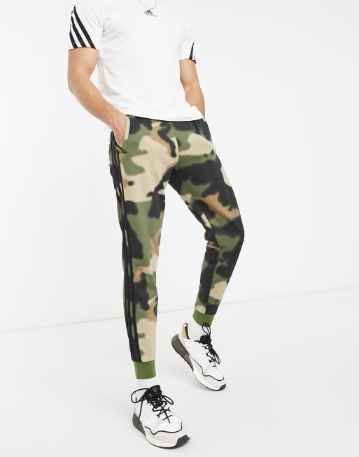 adidas Originals Graphics three stripe track pants in blurred camo | ASOS