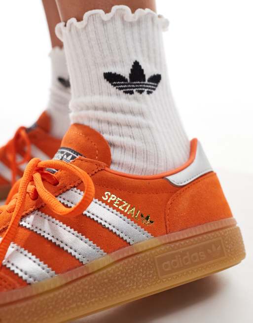 adidas Originals gum sole Handball Spezial trainers in orange and silver