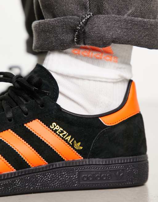 adidas Originals Handball Spezial gum sole trainers in black and orange BLACK