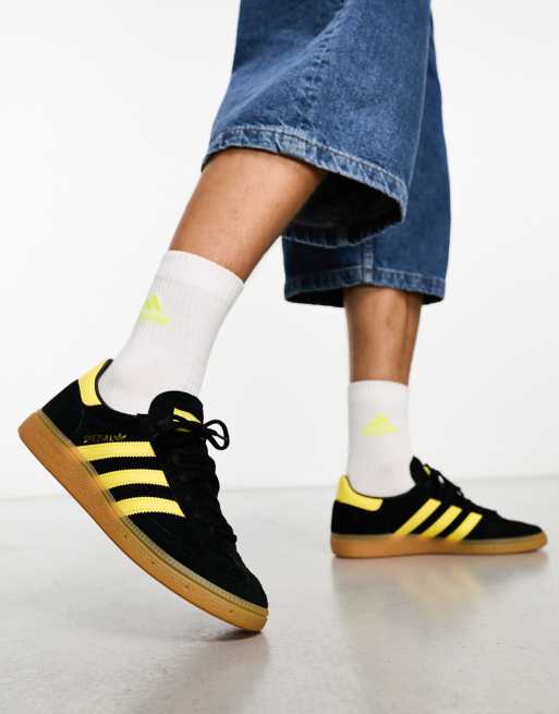 Black adidas on sale shoes with yellow