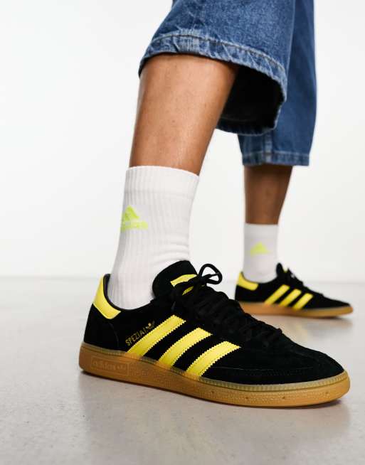 Adidas black 2025 yellow sneakers