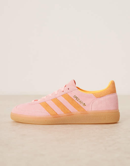 adidas Originals Handball Spezial trainers in pink and orange with gum sole
