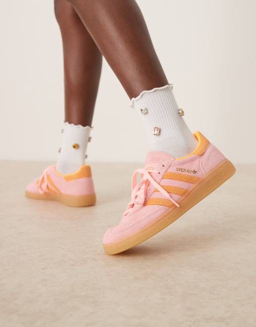 adidas Originals Handball Spezial trainers in pink and orange with gum sole