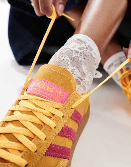 adidas Originals Handball Spezial sneakers in yellow and pink with gum sole