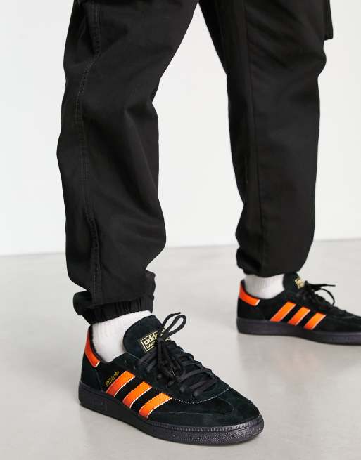 Orange and black sales adidas trainers