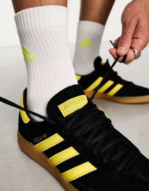 adidas Originals Handball Spezial trainers in black and yellow