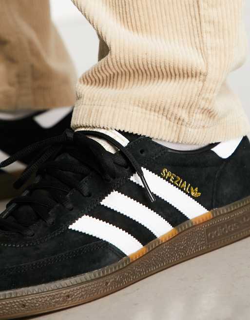 Black adidas on sale with gum sole