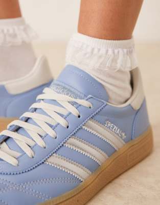 adidas Originals Handball Spezial trainers in blue and white stitch with gum sole