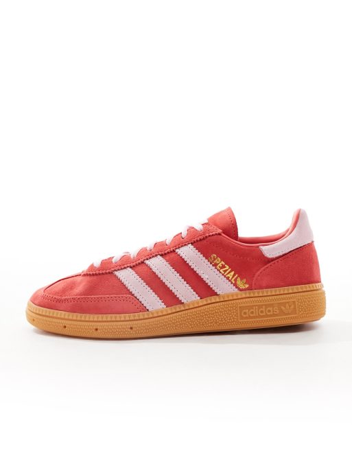 Pink and store red adidas trainers