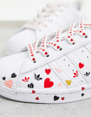 adidas originals heart print superstar sneaker in white