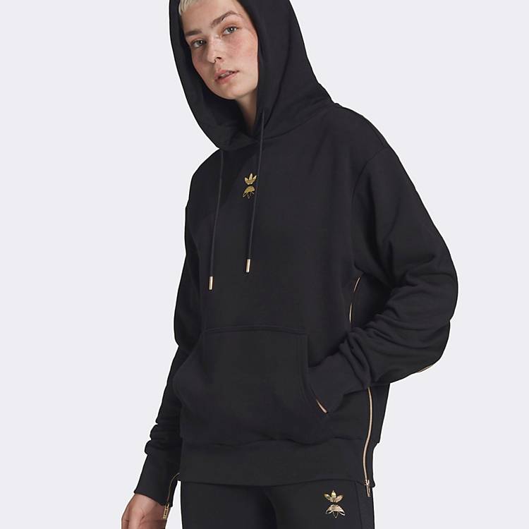 adidas Originals hoodie in black with gold logo and zipper detail | ASOS
