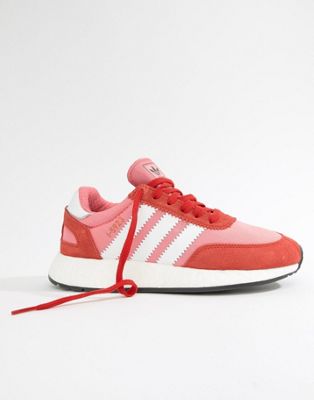 pink and red adidas trainers