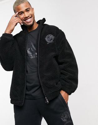 Adidas Originals jacket with collegiate crest in black teddy fleece